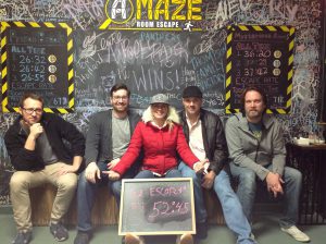 Seated after the escape room is the vTestify Team with a final score of 52 minutes and 45 seconds